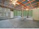Enclosed patio with concrete flooring and an open beam ceiling, perfect for entertaining at 3205 N 66Th St, Tampa, FL 33619