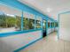 The screened-in porch with tiled floor provides an airy atmosphere and views of greenery at 3205 N 66Th St, Tampa, FL 33619
