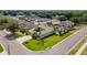 Aerial view of a residential neighborhood showcasing a well-kept one-story home with lush green lawns and landscaping at 3419 Trapnell Ridge Dr, Plant City, FL 33567