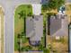 An aerial view of the one-story home showcasing the backyard screened-in lanai, and the surrounding neighborhood at 3419 Trapnell Ridge Dr, Plant City, FL 33567