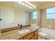 Bathroom featuring a granite countertop vanity, large mirror with lighting, and tiled shower and bath at 3419 Trapnell Ridge Dr, Plant City, FL 33567