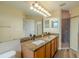 Bathroom featuring a double vanity, granite countertop, and a glass-enclosed shower at 3419 Trapnell Ridge Dr, Plant City, FL 33567