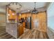 Kitchen featuring stainless appliances, wooden cabinets, and barn door in an open-concept design at 3419 Trapnell Ridge Dr, Plant City, FL 33567