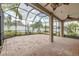 Large screened-in patio with brick flooring at 3419 Trapnell Ridge Dr, Plant City, FL 33567
