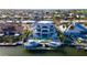 Desirable waterfront home with lush landscaping, dock, and boat lift, showcasing luxurious outdoor living at 531 68Th St, Holmes Beach, FL 34217