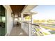 Expansive balcony overlooking water has wood ceiling and decorative railing at 531 68Th St, Holmes Beach, FL 34217
