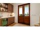 Entertaining bar area with custom cabinetry, beverage center and double door access to outdoors at 531 68Th St, Holmes Beach, FL 34217
