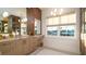Bathroom features a double vanity, updated fixtures, stylish mirrors, and bright natural light at 531 68Th St, Holmes Beach, FL 34217
