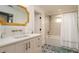 Bright bathroom featuring a single sink vanity, and shower-tub combo at 531 68Th St, Holmes Beach, FL 34217