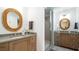 Stylish bathroom features stone counters, wooden cabinets, and tiled walk-in shower at 531 68Th St, Holmes Beach, FL 34217