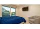 Comfortable bedroom with large glass doors offering scenic backyard views and private access to the pool area at 531 68Th St, Holmes Beach, FL 34217