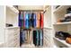 Spacious walk-in closet with custom shelving, hanging racks, and drawers provides ample storage at 531 68Th St, Holmes Beach, FL 34217