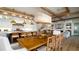 Open concept dining area features a large dining table and open to the kitchen at 531 68Th St, Holmes Beach, FL 34217