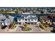 Stunning three-story waterfront home with manicured landscaping, three-car garage, and ample parking at 531 68Th St, Holmes Beach, FL 34217