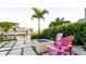 Outdoor fire pit with comfortable seating and waterfront views create a relaxing backyard living space at 531 68Th St, Holmes Beach, FL 34217