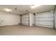 Spacious garage with epoxy flooring and two-car door, offering ample parking and storage space at 531 68Th St, Holmes Beach, FL 34217