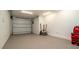 Clean, well-lit garage with epoxy flooring and ample space for storage and parking at 531 68Th St, Holmes Beach, FL 34217
