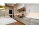 Gourmet kitchen with an eat-in island, stainless steel appliances, and ample cabinetry at 531 68Th St, Holmes Beach, FL 34217