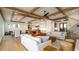 Open concept living space featuring a modern fireplace, plenty of seating and a view to the outside at 531 68Th St, Holmes Beach, FL 34217