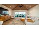 Open living room features stylish decor, water view balcony, and vaulted ceiling at 531 68Th St, Holmes Beach, FL 34217
