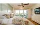 Spacious main bedroom with a paneled wall and water views at 531 68Th St, Holmes Beach, FL 34217