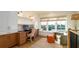 Home office with built in cabinetry, desk and comfortable seating overlooking outdoor view at 531 68Th St, Holmes Beach, FL 34217