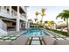 Picture of the elegant home highlighting the beautiful pool area with lounge chairs, lush landscaping, and modern design elements at 531 68Th St, Holmes Beach, FL 34217