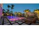Stunning outdoor pool with lounge chairs, lush landscaping, and captivating waterfront views for luxurious relaxation at 531 68Th St, Holmes Beach, FL 34217