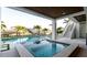 Inviting pool and spa area with lush landscaping and views of the canal providing a tranquil outdoor retreat at 531 68Th St, Holmes Beach, FL 34217