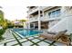 Stunning house exterior highlighting the inviting pool, outdoor spa, and modern architectural details, perfect for relaxation at 531 68Th St, Holmes Beach, FL 34217