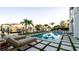 Inviting outdoor pool area with comfortable lounge chairs, meticulous landscaping, and beautiful waterfront scenery at 531 68Th St, Holmes Beach, FL 34217
