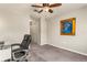 Spacious bedroom with a ceiling fan, plush carpet, and a view of a closet at 10642 Lake Montauk Dr, Riverview, FL 33578