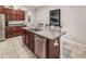 Spacious kitchen island with a double sink, bar seating, and ample counter space for meal preparation at 10642 Lake Montauk Dr, Riverview, FL 33578