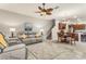 Open-concept living room with a staircase, and eat in kitchen making entertaining easy at 10642 Lake Montauk Dr, Riverview, FL 33578