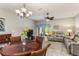 Cozy living room with modern furniture, a ceiling fan, and access to an outdoor patio at 10642 Lake Montauk Dr, Riverview, FL 33578
