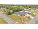 An aerial view of the house showing the roof, landscaping, and surrounding neighborhood at 11447 Adelia St, Spring Hill, FL 34608