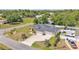 An aerial view of the home showcasing its well-manicured lawn and long driveway at 11447 Adelia St, Spring Hill, FL 34608