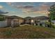 Backyard with a screened-in pool and patio area, plus a convenient storage shed at 11447 Adelia St, Spring Hill, FL 34608
