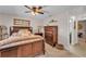 Bedroom featuring a wood bedframe, dresser, and side table, and ceiling fan at 11447 Adelia St, Spring Hill, FL 34608