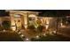 Charming single-story home with a well-lit walkway, inviting entrance, and beautifully landscaped front yard at 11447 Adelia St, Spring Hill, FL 34608