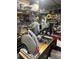 Cluttered garage featuring a variety of tools and equipment on workbench at 11447 Adelia St, Spring Hill, FL 34608