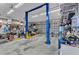 Spacious garage featuring a vehicle lift, ample storage, and a clean, organized layout for car enthusiasts at 11447 Adelia St, Spring Hill, FL 34608