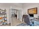 Comfortable office space with natural light and an open doorway into the kitchen and dining area at 11447 Adelia St, Spring Hill, FL 34608