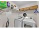 Laundry room with shelving and modern appliances at 11447 Adelia St, Spring Hill, FL 34608