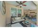 Relaxing covered patio with comfortable seating and view of the pool, great for entertaining at 11447 Adelia St, Spring Hill, FL 34608