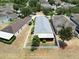 Aerial view of a home with fenced backyard, showing the surrounding neighborhood and tree coverage at 12654 Belcroft Dr, Riverview, FL 33579