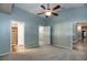 Large bedroom with high ceilings and ensuite bathroom featuring a glass shower at 12654 Belcroft Dr, Riverview, FL 33579