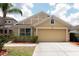 Charming one-story home featuring a two-car garage, manicured lawn and beautifully landscaped front yard at 12654 Belcroft Dr, Riverview, FL 33579