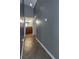 Hallway featuring neutral colored paint and tile floors leading to other rooms of the house at 12654 Belcroft Dr, Riverview, FL 33579
