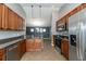 Beautiful kitchen with granite countertops and stainless steel appliances overlooking living area at 12654 Belcroft Dr, Riverview, FL 33579